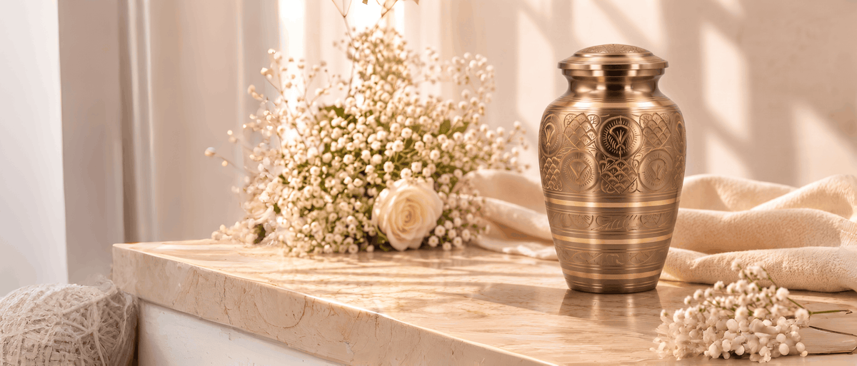 The finished hand-etched brass urn