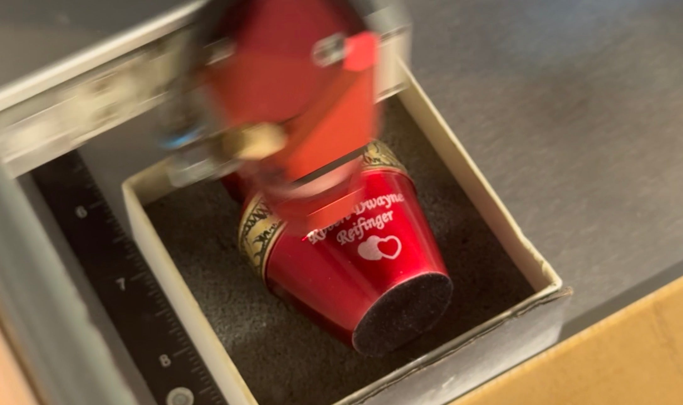 An urn being engraved on our machine in the Richmond workshop